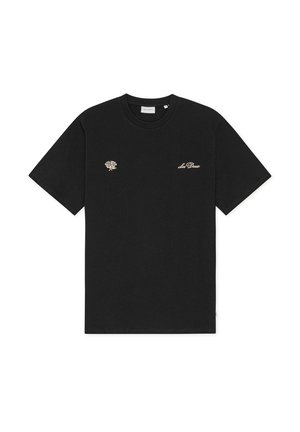 T-shirt noir à manches courtes avec un petit motif de rose beige sur le côté gauche de la poitrine et le texte en cursive "Los Deux" sur le côté droit de la poitrine.