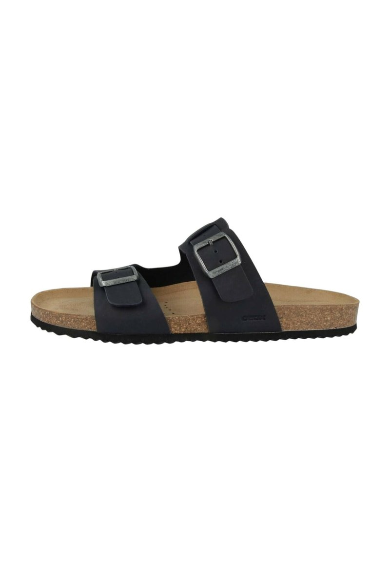 Sandalo nero a due fascette con fibbie in metallo, soletta in sughero e suola in gomma testurizzata. Il materiale superiore liscio offre durata e comfort.