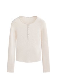 Langärmliges, cremfarbenes Oberteil aus geripptem Stoff mit einem runden Halsausschnitt und sechs Knöpfen auf der Vorderseite. Unregelmäßiger Saum am unteren Rand.