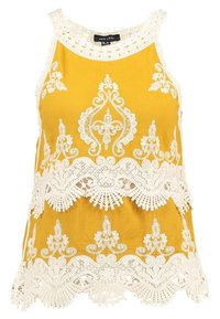 Keltainen hihaton toppi, jossa on monimutkainen valkoinen pitsikoristelu, aaltoileva helma ja pyöreä pääntie, valmistettu kevyestä kankaasta.