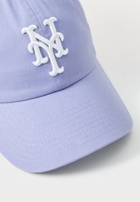 Light purple baseball cap made of cotton with a curved brim. Features embroidered white NY logo on the front. Textured fabric.