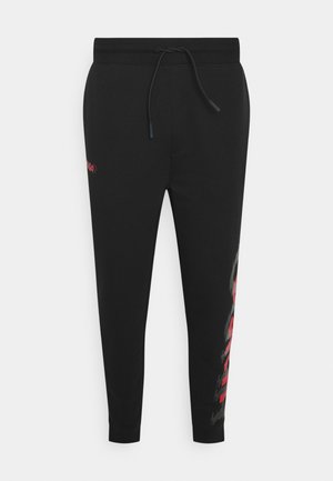 DARLOWE - Tracksuit bottoms - black