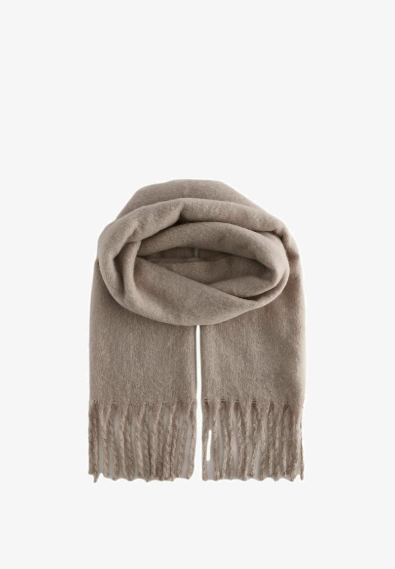 Écharpe en laine beige avec une texture douce, dotée de bords frangés et d'un design décontracté. Idéale pour les superpositions par temps froid.
