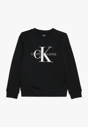 Sweat-shirt noir à manches longues avec col rond, arborant le logo blanc "CK" et "Calvin Klein Jeans" centré sur le devant.