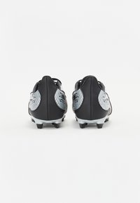 Black football cleats with silver accents, featuring a textured design and a low profile. Spike studs on the outsole for traction.