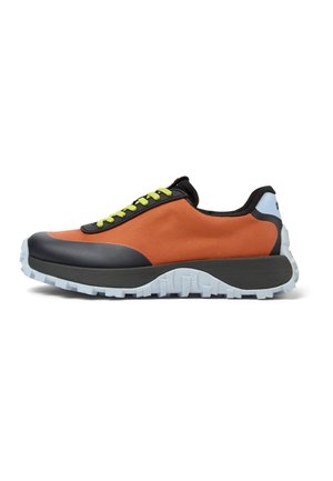 Black and orange sneaker with a textured fabric upper, green laces, and a thick, white rubber tread sole. Lightweight design with accent details.