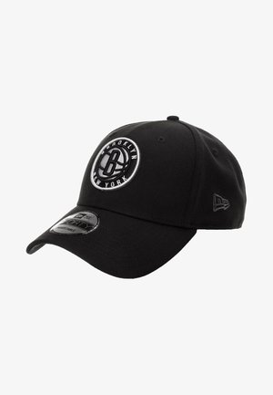 Black baseball cap made of fabric, featuring a round Brooklyn logo in white and silver embroidery on the front, with adjustable strap.