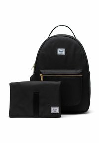 Sac à dos Herschel noir avec poche zippée à l'avant et matelas à langer pliable noir assorti avec des patchs de logo.