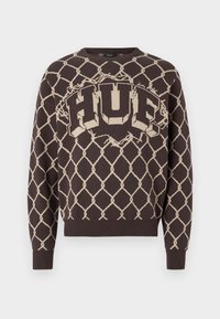 Dark brown sweater with beige chain-link pattern and large beige "HUF" logo across the chest, ribbed cuffs, and hem.