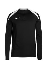 Zwarte sportieve top met lange mouwen en een halve rits, met witte accenten op de schouders en een gladde, rekbare stof. Nike-logo weergegeven.