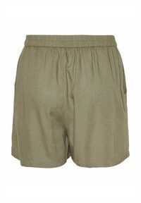 Shorts in lino verde oliva con vita elasticizzata, tasche laterali e pieghe sottili per un tocco in più. Tessuto liscio, design informale.