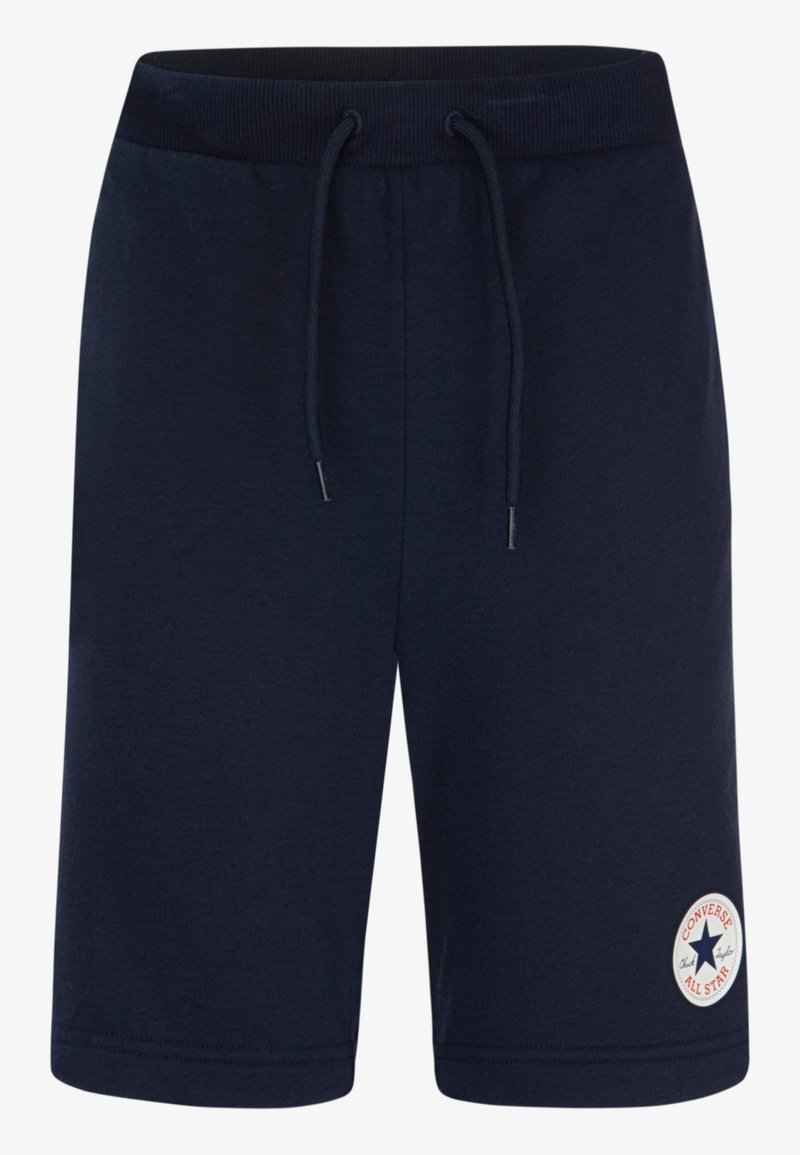 Pantaloni corti in cotone blu navy con cintura elastica e coulisse, caratterizzati da un'etichetta rotonda con il logo Converse All Star sulla gamba sinistra.