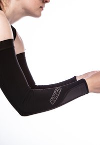 Black arm sleeves made of elastic material, featuring a textured, grey accent panel and a logo. Sleeves cover upper arms and forearms.