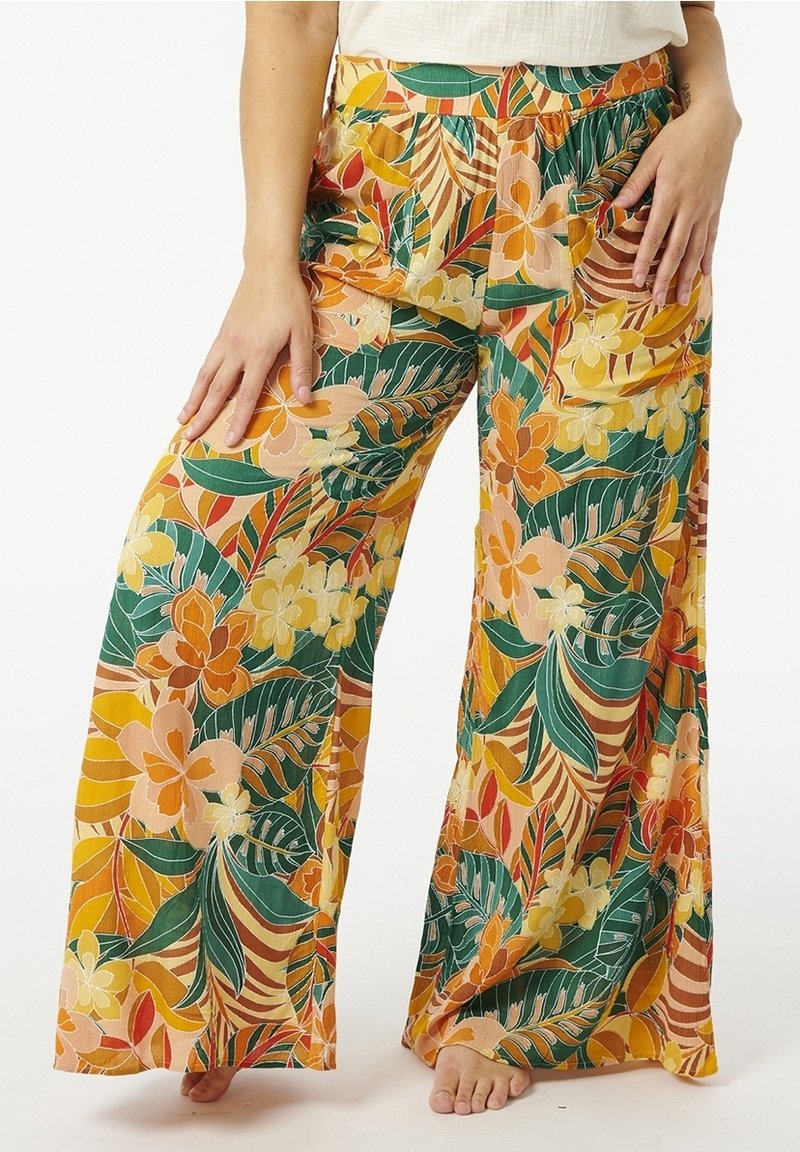Pantalons larges à motifs floraux dans des tons vifs d'orange, de vert et de jaune, avec une taille élastique. Tissu léger, coupe décontractée.