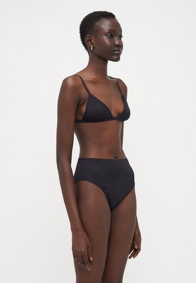 Black bikini set featuring a minimalist triangle top with thin straps and high-waisted bottoms. Smooth, matte texture with no visible patterns.