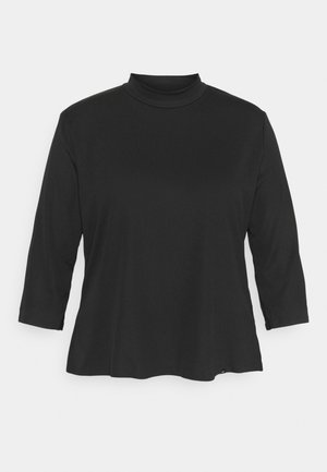 Schwarzer Rollkragenpullover mit Dreiviertelärmeln. Hergestellt aus einem weichen, strukturierten Stoff, zeichnet sich durch eine lockere Passform und einen leicht geschwungenen Saum aus.