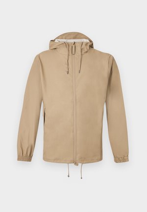 Beige gewatteerd jack met capuchon, voorzien van een rits aan de voorkant, verstelbare trekkoorden aan de capuchon en zoom, en elastische manchetten, getoond op een witte achtergrond.