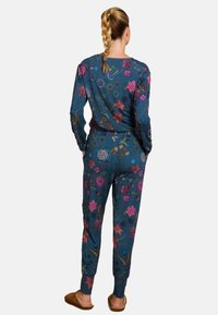 Floraalpatroon loungewear-set in donkerblauw, met lange mouwen en taps toelopende broek, vervaardigd uit zachte stof met geribbelde manchetten.