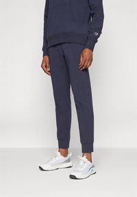Champion ICONS RIB CUFF PANTS  - Spodnji deli trenirk - dark blue