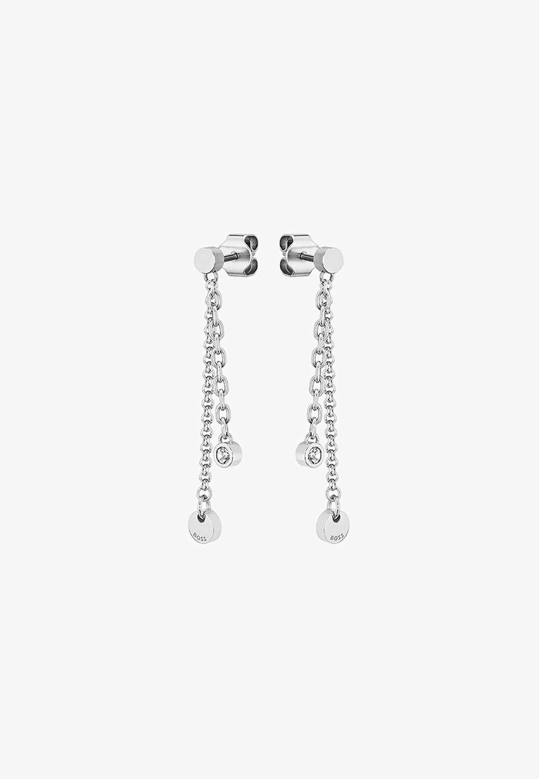 Silver earrings with dangling chain design, featuring small circular accents and rhinestone detailing. Clean, modern aesthetic.