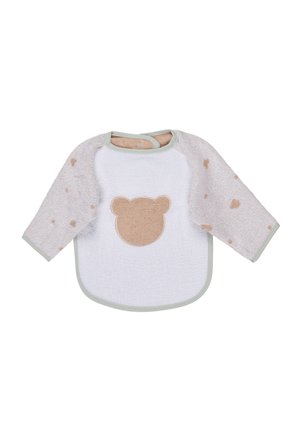 Bavaglino per neonati a maniche lunghe con maniche beige decorate con motivi a cuore e pannello frontale bianco con applicazione di una faccia di orsetto.