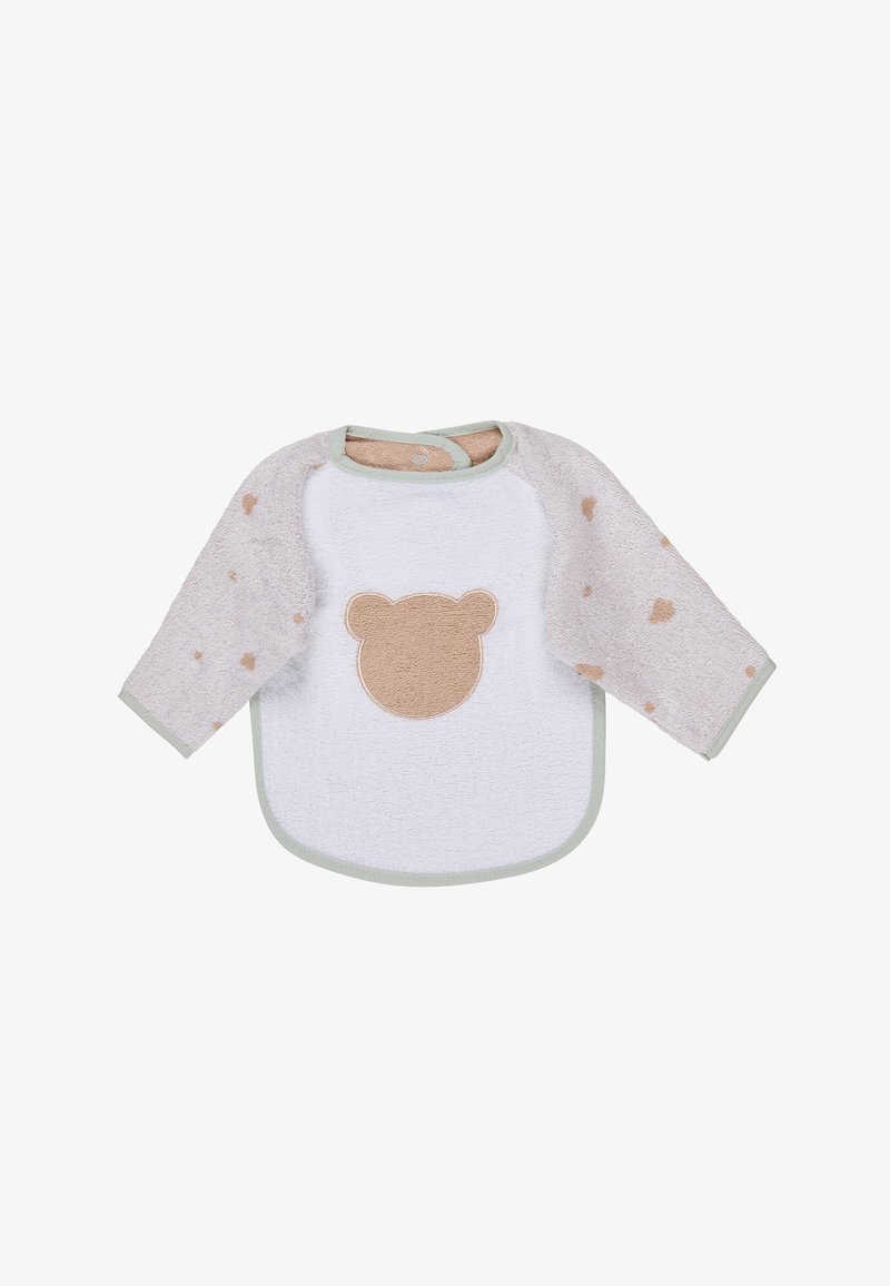 Bavoir bébé à manches longues avec des manches beige ornées de motifs de cœurs et un devant blanc avec une applique en forme de visage d'ourson.