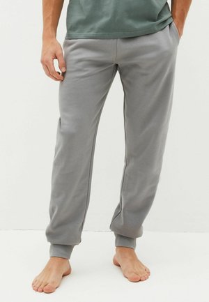 Grau Sweatpants mit einem gerippten Bund und Säumen. Hergestellt aus einem weichen Stoff, mit Seitentaschen und einem lockeren Schnitt. Minimale Designdetails.