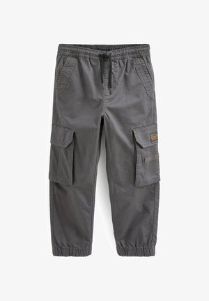 Pantalon cargo gris foncé avec taille et poignets élastiques, cordon noir, poches latérales à rabat et poches avant inclinées.