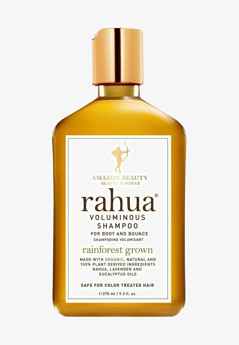 Rahua Volumenshampoo in einer rechteckigen bernsteinfarbenen Flasche mit einem goldenen Deckel. Das Etikett zeigt weiße und goldene Schriftzüge sowie Details zu den Inhaltsstoffen und der Anwendung.