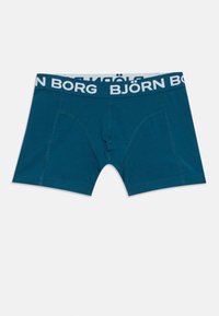 Τουαλέτες μποξέρ σε teal μπλε με λευκό λογότυπο "BJÖRN BORG" στη ελαστική μέση και ορατά ραφή μπροστά.