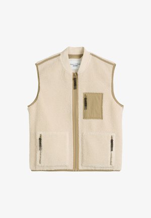 Ärmellose cremefarbene Sherpa-Weste mit beigem Besatz, Vorderreißverschluss, zwei unteren Reißverschlusstaschen und einer Reißverschlusstasche auf der rechten Seite der Brust.