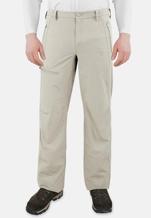 Beige Wanderhose mit geradem Schnitt, ausgestattet mit seitlichen Reißverschlusstaschen und verstärkten Knien, aus leichtem, strapazierfähigem Material.