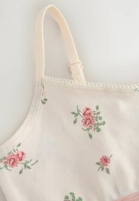 Könnyű krém színű anyagú bralette, rózsaszín és zöld virágmintával. Állítható pántokkal és picot csipkehímzéssel a szélén.