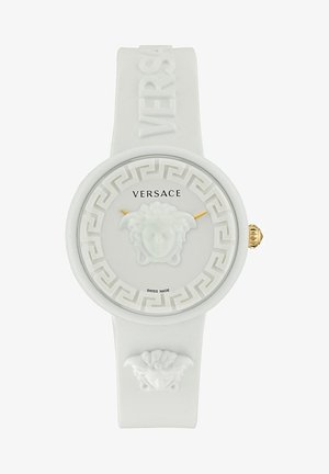 Hvidt silikoneur med præget græsk nøglemønster, der har et centralt Medusa-hoved, guldfarvede detaljer og "SWISS MADE" tekst. Versace branding.