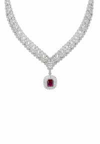 Diamond necklace with a v-shaped design, featuring a central red gemstone surrounded by intricate silver accents and multiple sparkling stones.