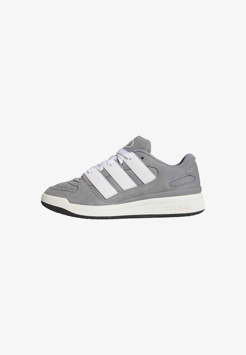 Gray suede sneakers with white leather accents, featuring three white stripes, round toe, and a textured rubber sole.