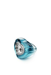 Blue translucent ring with heart-shaped clear crystal centerpiece, surrounded by silver accents. Smooth surface with a shiny finish.