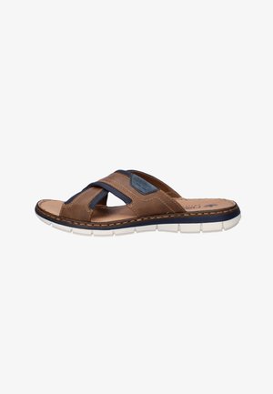 Brown leather slip-on sandal with navy fabric accents and white segmented sole, side view.