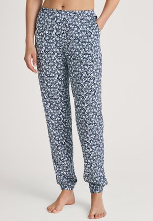 Marinefarbene Schlafanzhose mit weißem Blumenmuster, ausgestattet mit einem elastischen Bund und seitlichen Taschen. Hergestellt aus weichem, leichtem Stoff.