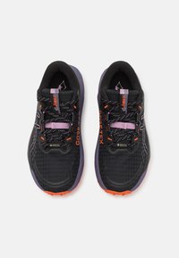 Multi-colored running shoes featuring a black mesh upper, orange and purple accents, textured sole, and waterproof GORE-TEX branding.