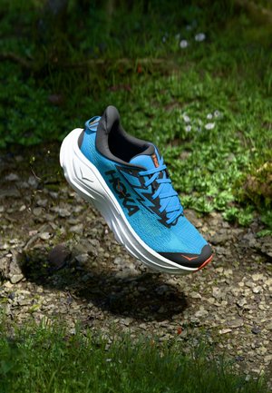 Blue athletic shoe with a mesh upper, black accents, and orange detailing. Features a cushioned sole and round toe shape.