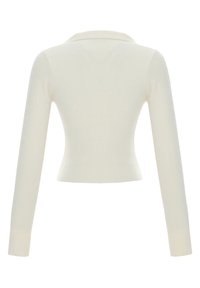 Haut en maille à manches longues côtelées de couleur crème, coupe courte et col simple, vu de dos.