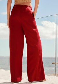 Next WIDE LEG. TALL - Püksid - red