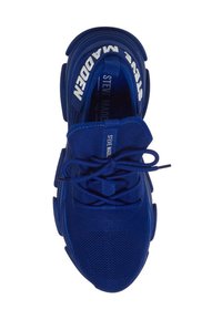 Blue athletic shoe with textured mesh upper, thick rubber sole, and prominent laces. Branding on tongue in white lettering.