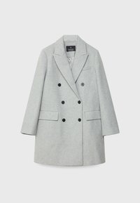 Grijze dubbelgeknoopte jas van gestructureerde stof. Voorzien van zwarte knopen, twee steekzakken, een reverskraag met inkeping en een borstzak.