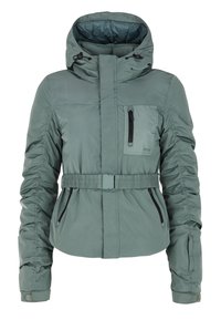 Groene gewatteerde jas met capuchon, voorkant met ritssluiting, elastische riem in de taille en zijzakken met ritssluiting. Heeft gathered mouwen en een gestructureerde afwerking.