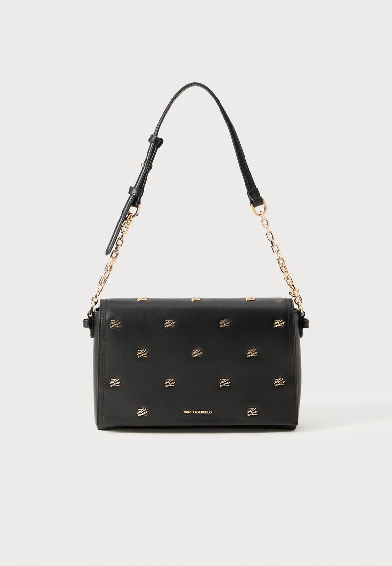 Black leather handbag with gold-tone emblem accents, rectangular shape, short top handle, and detachable chain shoulder strap.