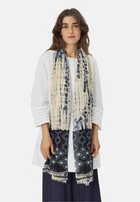 Lightweight scarf with cream and blue tie-dye pattern, featuring a dark blue geometric design at the bottom and fringed edges.