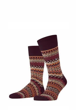 Par de calcetines hasta media pantorrilla con elaborados patrones tribales en colores burdeos, naranja, beige y rosa sobre un fondo blanco.