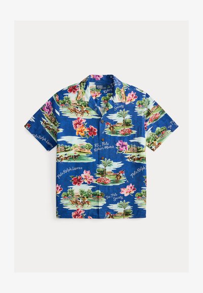 Chemise bleu à manches courtes avec boutons, motifs floraux tropicaux, palmiers, joueurs de polo, et texte "Polo Ralph Lauren".